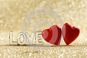 Red hearts on glitter background