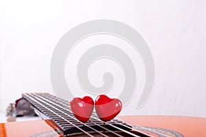 Red hearts on guitar strings