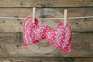 Red hearts hanging on the clothesline