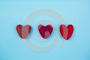 Red hearts on a light Blue Background