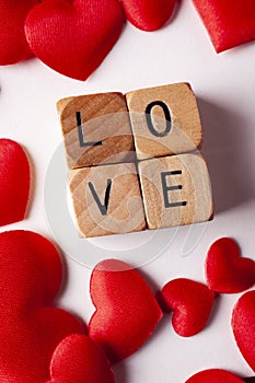 Red hearts and love letters on wooden dice