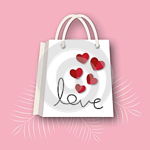 Red hearts with paper bag and leaf on pink background. Greeting card for Valentine or Wedding