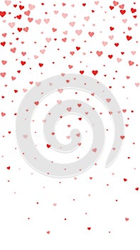 Red hearts scattered on white