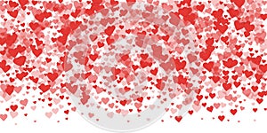 Red hearts scattered on white
