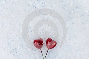 Red hearts on snowy background. Love is in the air. Valentines day design concept. Copy Space