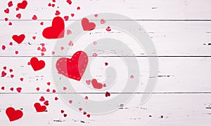 Red hearts on a white wooden background. Top view, free space for text. valentine`s day, love