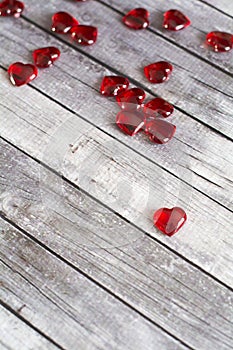Red hearts on wood background