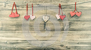 Red hearts on wooden background. Valentines Day. Retro style