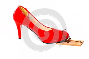 Red high heel in a mousetrap photo