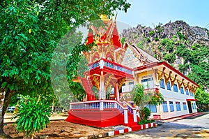 The red Ho Rakang belfry of Wat Suwan Kuha Cave Temple, Phang Nga, Thailand