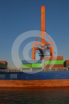 Red hoisting crane work into port