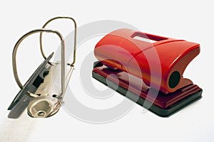 Red hole puncher isolated on a white background