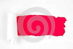 Red Hole in the white paper with torn sides, copy space