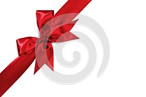 Red holiday bow on white background