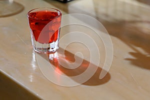 red holiday shot served in a clear glass