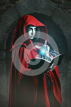 Red hooded woman casting powerful magic