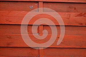 Red horizontal wooden wall fence texture for orange background wood planks brown facade