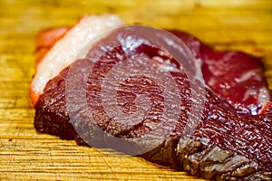 Red horse meat on wooden cutting