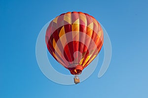 Red Hot air balloon on deep blue sky