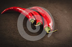 Red hot Chile pepper on a dark background/red hot Chile pepper o