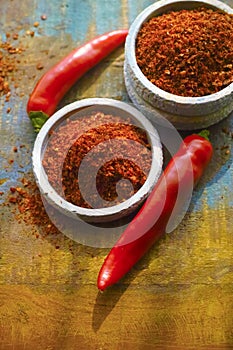 Red hot chili Cayenne pepper fresh and dried powdered spice, ready to use.