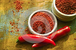 Red hot chili Cayenne pepper fresh and dried powdered spice, ready to use.