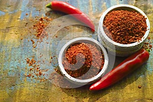 Red hot chili Cayenne pepper fresh and dried powdered spice, ready to use.