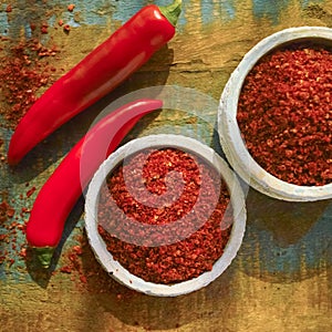 Red hot chili Cayenne pepper fresh and dried powdered spice, ready to use.