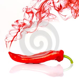 Red hot chili pepper isolated on white with red smoke