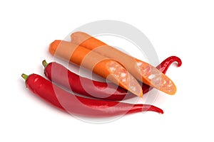 Red hot chili pepper and sausages isolated on white background