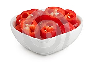 red hot chili pepper slices in ceramic bowl isolated on white background