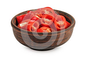 red hot chili pepper slices in ceramic bowl isolated on white background