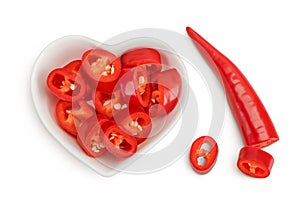 red hot chili pepper slices in ceramic bowl isolated on white background. Top view. Flat lay.