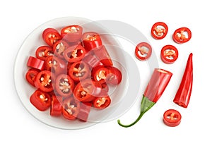 red hot chili pepper slices in ceramic bowl isolated on white background. Top view. Flat lay.