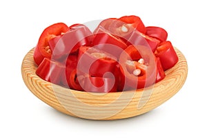 red hot chili pepper slices in wooden bowl isolated on white background