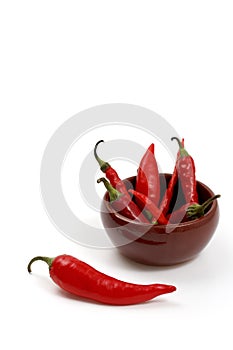 Red hot chili peppers in ceramic bowl