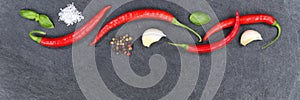 Red hot chili peppers chilli cooking ingredients copyspace banner slate top view