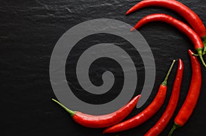 Red hot chili peppers on a dark background