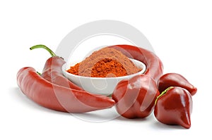 Red hot chili peppers pods and pepper in powder in a bowl