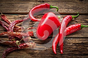 Red hot chili peppers, sweet pepper on wooden table