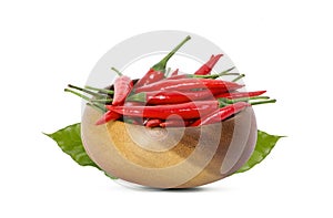 Red hot chili peppers in wooden bowl on white background