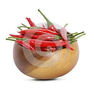 Red hot chili peppers in wooden bowl on white background