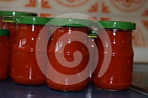 red hot chili sauce in reused jars