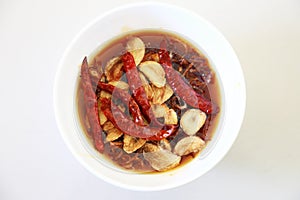 Red hot chilli sauce isolated on a white background