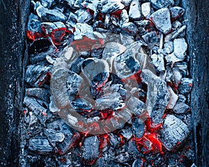 Red-hot firebrands in a bonfire
