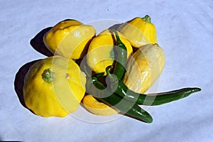 Red hot green chili peppers and yellow crookneck squash