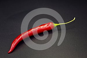 Red hot natural chili pepper. Fresh organic  chili pepper on black