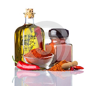 Red Hot Paprika Powder and Olive Oil on White Background