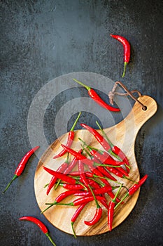 Red Hot Pepper Chili Peppers on a cutting wooden board