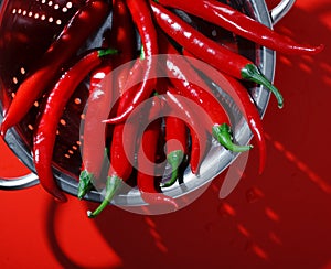 Red hot peppers in colander